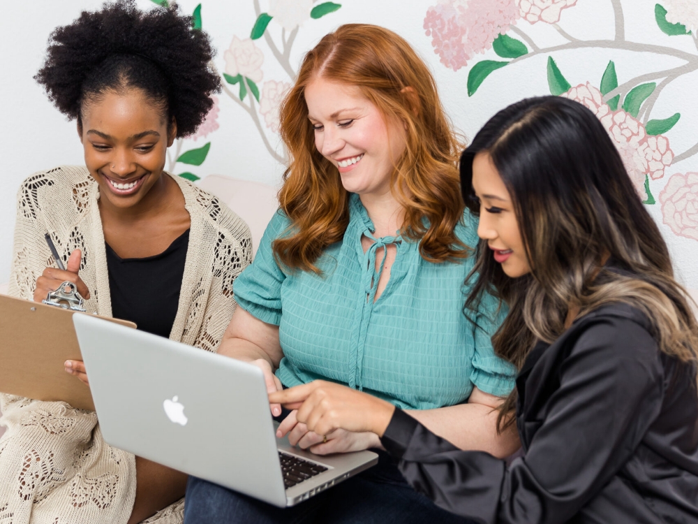 friends looking at a laptop